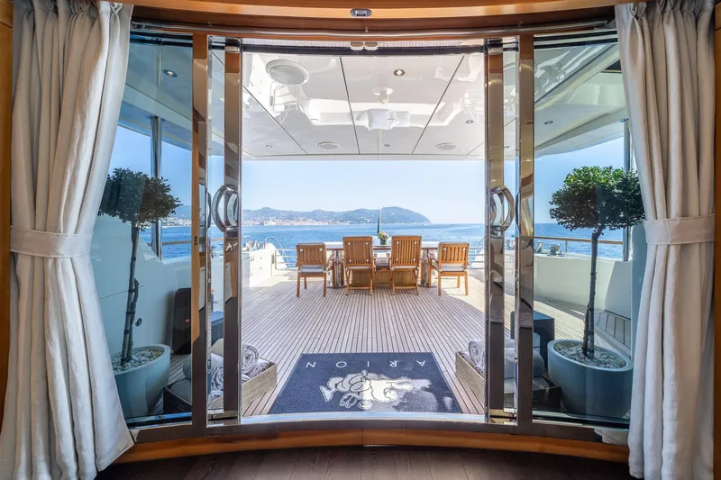 Arion Yacht Photos Pics Luxurious 2011 Guy Couach 121' yacht deck with ocean view and elegant seating area.