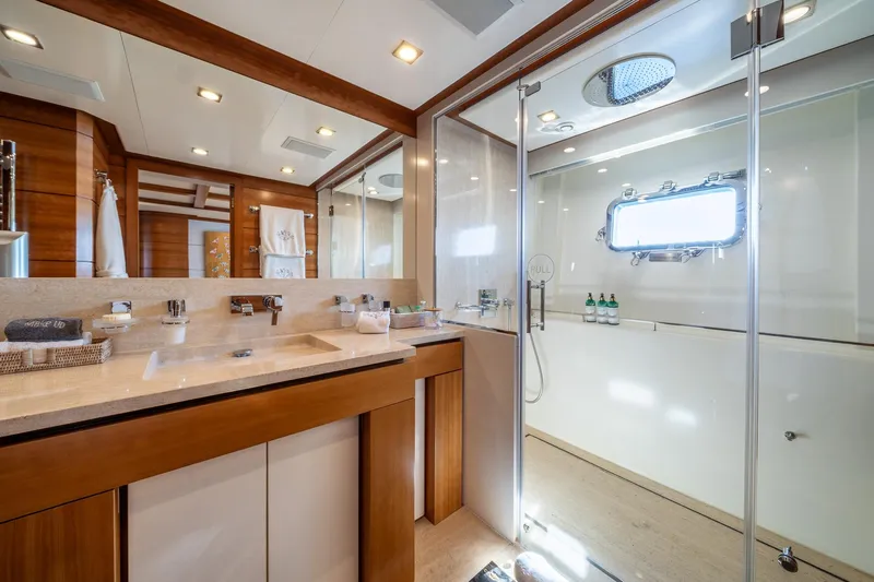 Arion Yacht Photos Pics Luxurious bathroom on 2011 Guy Couach 121' yacht with modern fixtures and spacious shower.