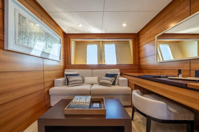 Arion Yacht Photos Pics Luxurious interior of 2011 Guy Couach 121' yacht with elegant wood paneling and modern furnishings.