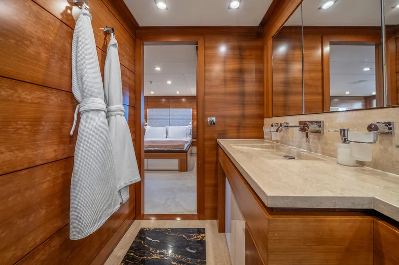 Arion Yacht Photos Pics Luxurious bathroom on 2011 Guy Couach 121' yacht with wooden accents and modern fixtures.
