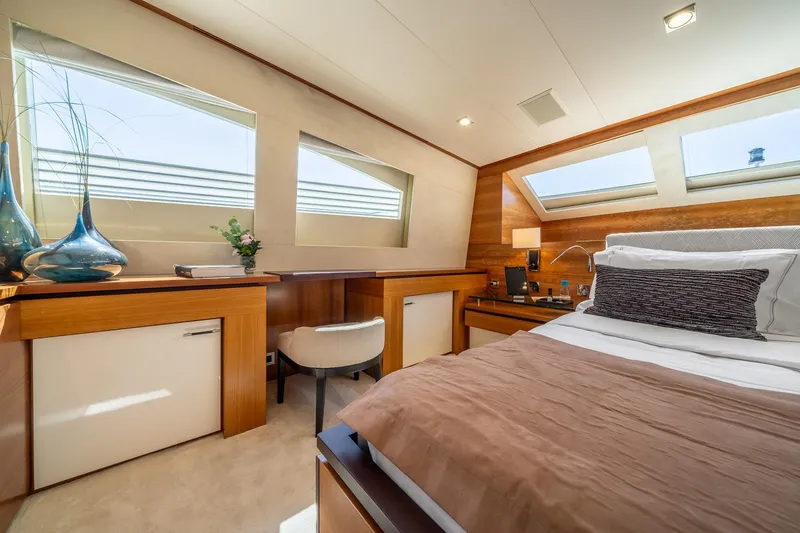 Arion Yacht Photos Pics Luxurious bedroom interior on 2011 Guy Couach 121' yacht, featuring modern design and elegant decor.