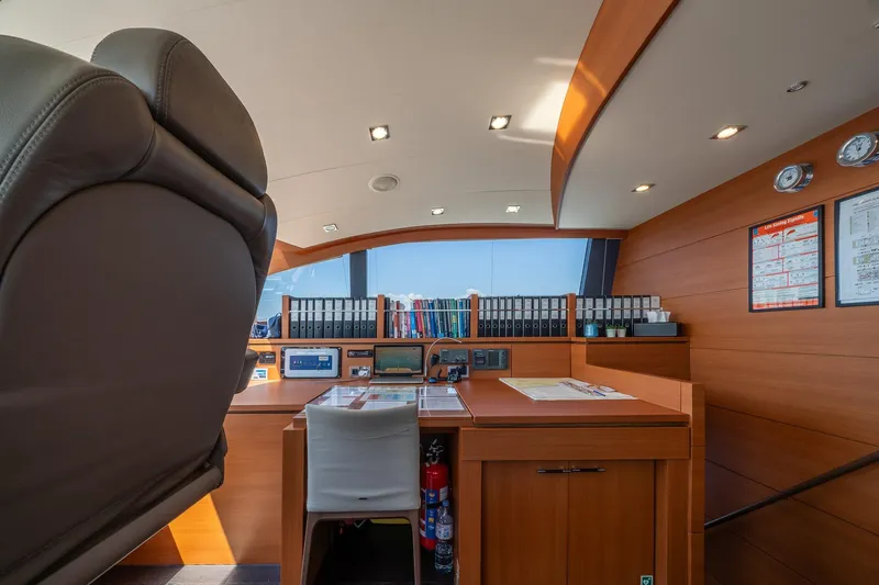 Arion Yacht Photos Pics Luxurious Guy Couach 121' yacht interior, featuring a modern navigation station, 2011 model.