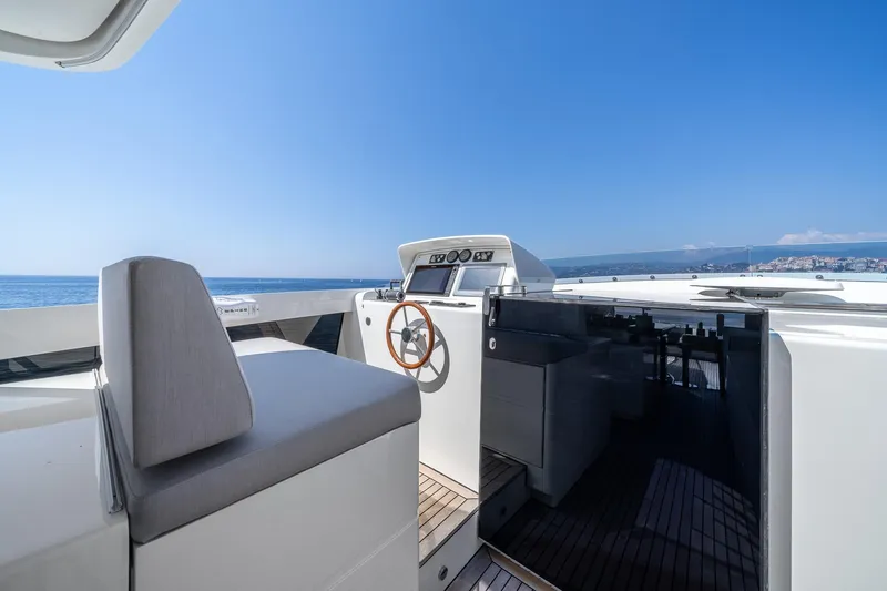 Arion Yacht Photos Pics Luxurious 2011 Guy Couach 121' yacht helm with ocean view and sleek design.