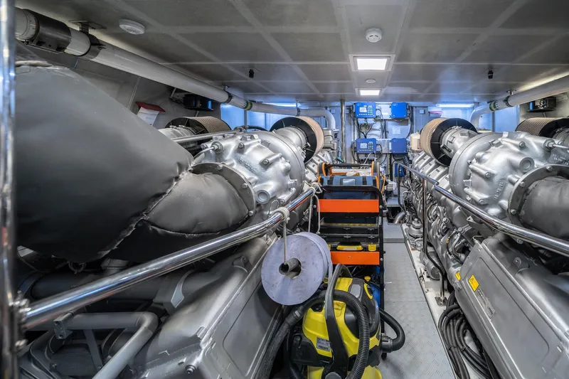 Arion Yacht Photos Pics Engine room of 2011 Guy Couach 121' yacht, featuring dual engines and control systems.