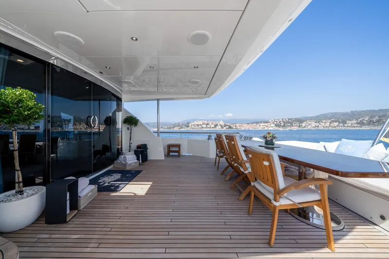 Arion Yacht Photos Pics Luxurious 2011 Guy Couach 121' yacht deck with elegant seating and scenic ocean view.