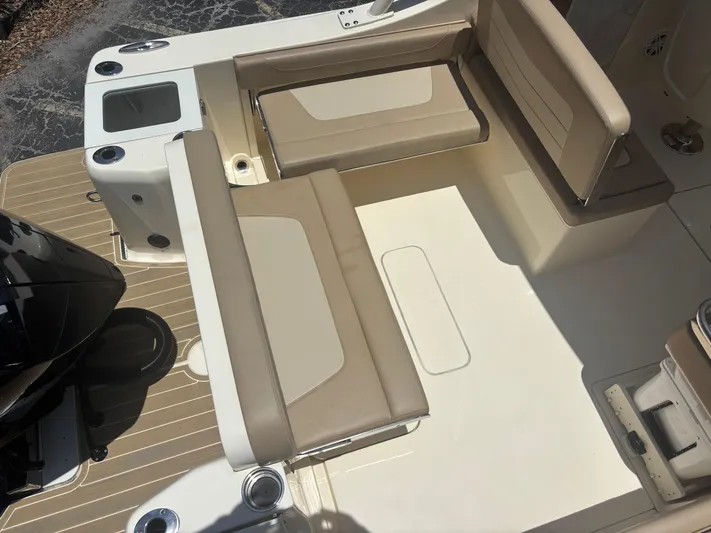  Yacht Photos Pics 2024 Scout 240 Dorado boat interior with beige seating and deck layout.