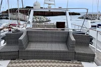 Outdoor seating on De Groot UNIQUE MODEL yacht, 1984, with ocean view.