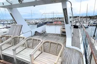 Deck view of 1984 De Groot UNIQUE MODEL yacht in marina setting.