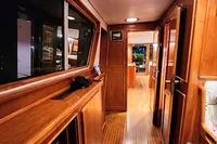 Interior of 1984 De Groot UNIQUE MODEL yacht with wooden finishes and ambient lighting.