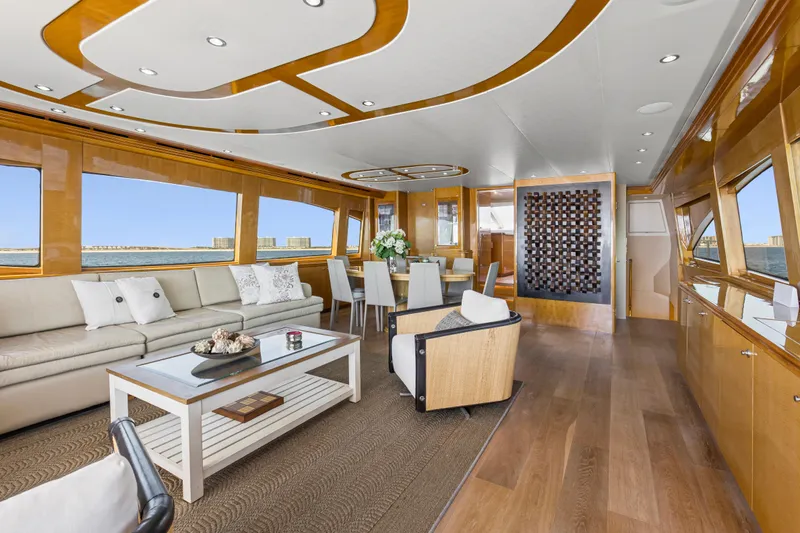 Time-2 Fly Yacht Photos Pics Luxurious interior of 2006 Hatteras 80 Motor Yacht Sky Lounge with elegant furnishings.