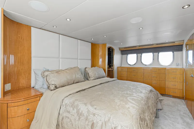 Time-2 Fly Yacht Photos Pics Luxurious bedroom interior of 2006 Hatteras 80 Motor Yacht Sky Lounge with elegant bedding.