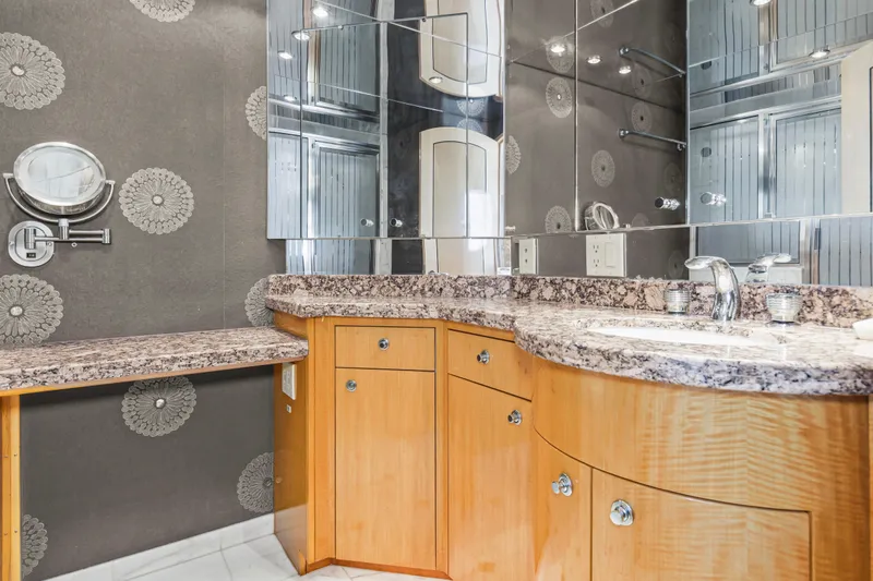 Time-2 Fly Yacht Photos Pics Luxurious bathroom in 2006 Hatteras 80 Motor Yacht Sky Lounge with granite countertops.