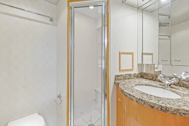 Time-2 Fly Yacht Photos Pics Luxurious bathroom in 2006 Hatteras 80 Motor Yacht Sky Lounge with granite countertop.