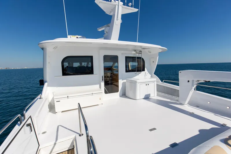 Time-2 Fly Yacht Photos Pics 2006 Hatteras 80 Motor Yacht Sky Lounge on open sea, sunny day.