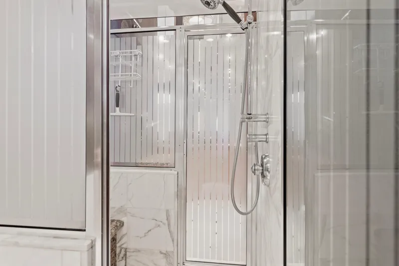 Time-2 Fly Yacht Photos Pics Luxurious bathroom with marble accents on 2006 Hatteras 80 Motor Yacht Sky Lounge.