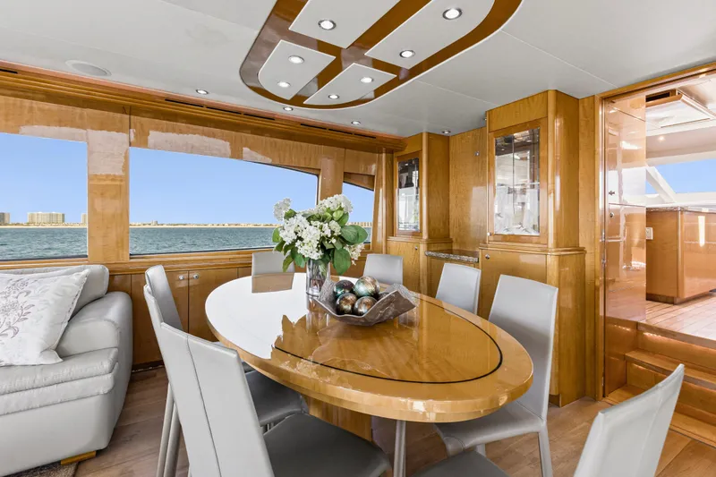 Time-2 Fly Yacht Photos Pics Luxurious dining area on 2006 Hatteras 80 Motor Yacht Sky Lounge with ocean view.