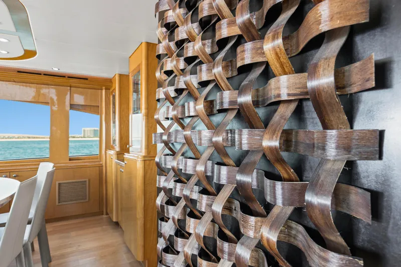 Time-2 Fly Yacht Photos Pics Luxurious interior of 2006 Hatteras 80 Motor Yacht Sky Lounge with intricate wood design.