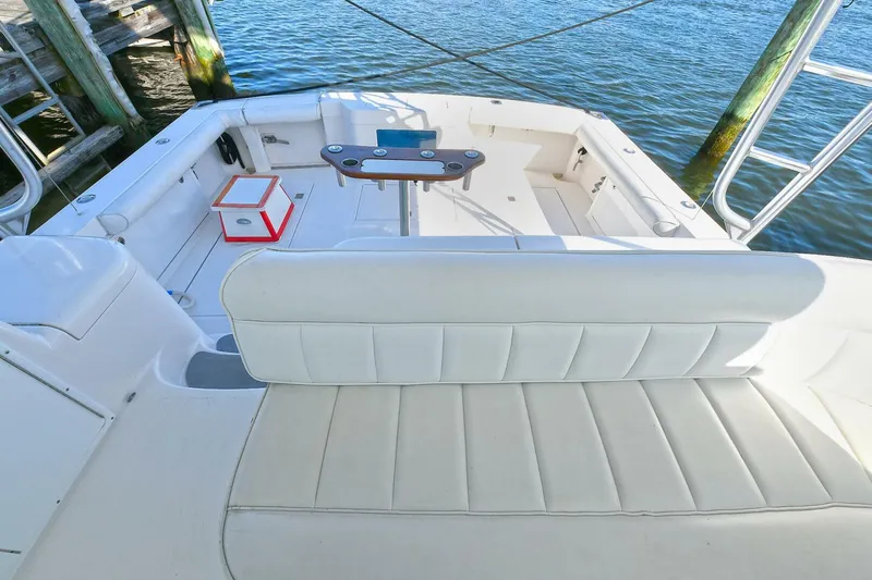 Trios Yacht Photos Pics 2007 Cabo 40 Express boat interior with seating and fishing rod holders.