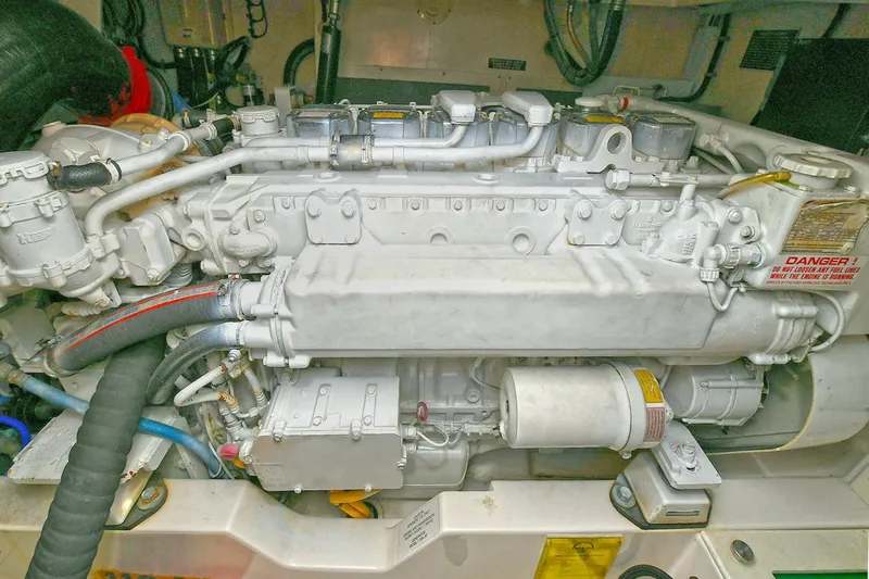 Trios Yacht Photos Pics Engine of 2007 Cabo 40 Express with Tower, showcasing intricate mechanical components.