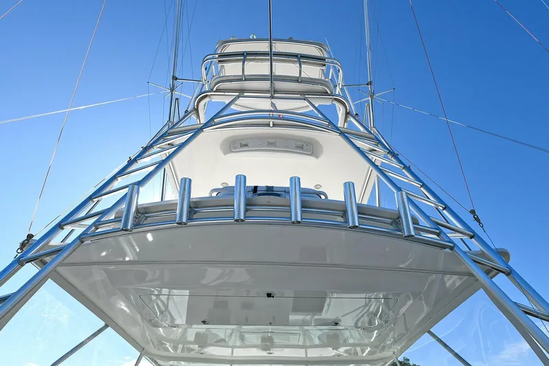Trios Yacht Photos Pics 2007 Cabo 40 Express with Tower, viewed from below against a clear blue sky.