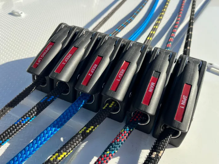 Family Therapy Yacht Photos Pics Close-up of labeled rope clutches on a 2023 Fountaine Pajot Elba 45 catamaran.