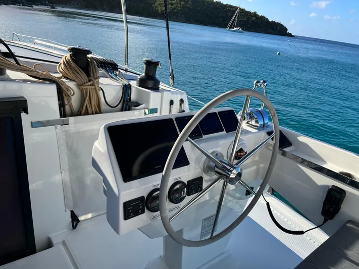 Family Therapy Yacht Photos Pics Helm of 2023 Fountaine Pajot Elba 45 catamaran with ocean view.