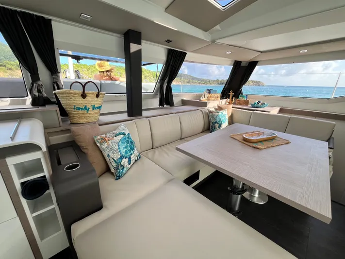 Family Therapy Yacht Photos Pics Luxurious interior of 2023 Fountaine Pajot Elba 45 catamaran with ocean view.