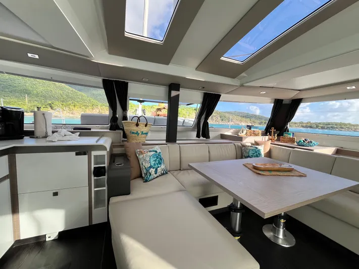 Family Therapy Yacht Photos Pics Luxurious interior of 2023 Fountaine Pajot Elba 45 catamaran with scenic ocean view.