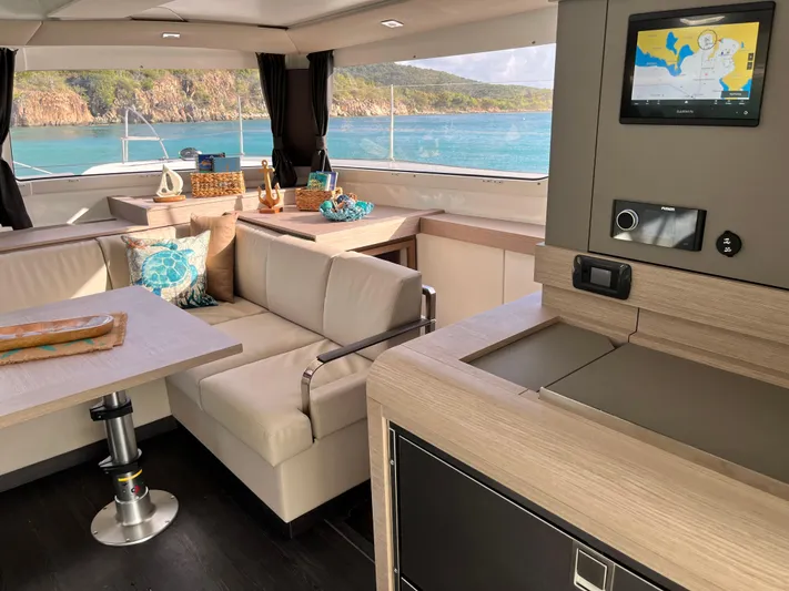 Family Therapy Yacht Photos Pics Luxurious interior of 2023 Fountaine Pajot Elba 45 catamaran with ocean view.