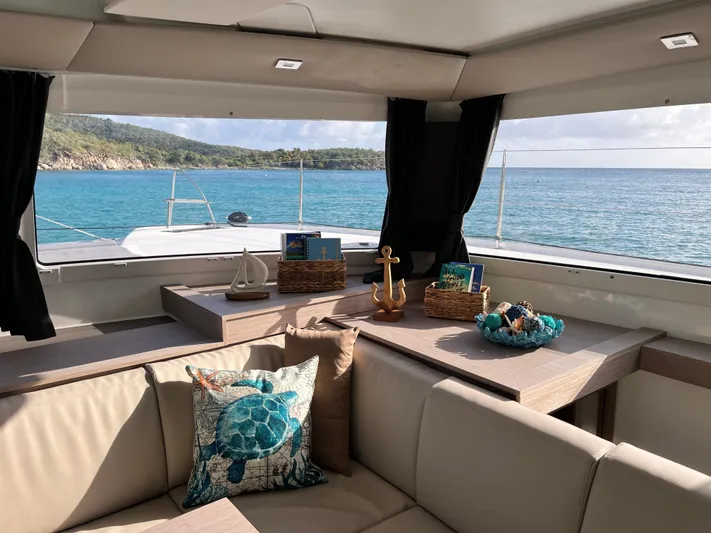 Family Therapy Yacht Photos Pics Interior of 2023 Fountaine Pajot Elba 45 yacht with ocean view and nautical decor.