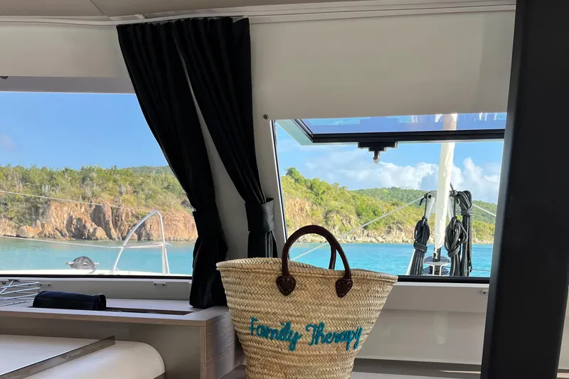 Family Therapy Yacht Photos Pics Interior view of 2023 Fountaine Pajot Elba 45 yacht with scenic ocean backdrop.