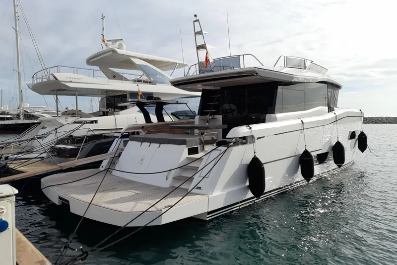  Yacht Photos Pics 2023 Pardo Yachts E60 docked at marina, sleek design, luxury motor yacht.