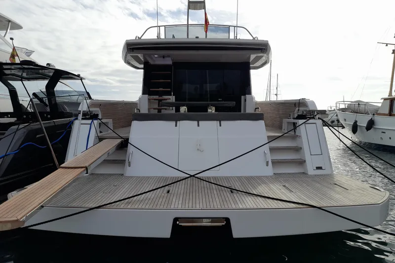  Yacht Photos Pics 2023 Pardo Yachts E60 docked, showcasing sleek design and spacious deck.