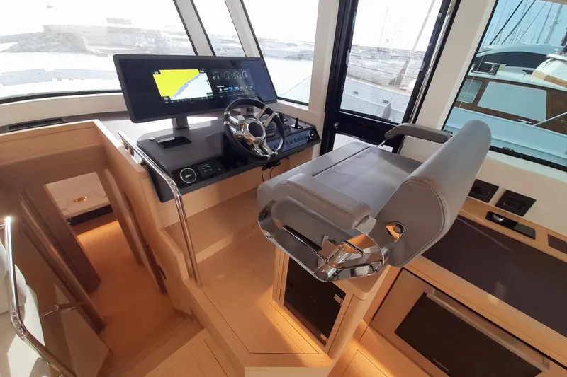  Yacht Photos Pics 2023 Pardo Yachts E60 helm station with modern controls and luxurious seating.