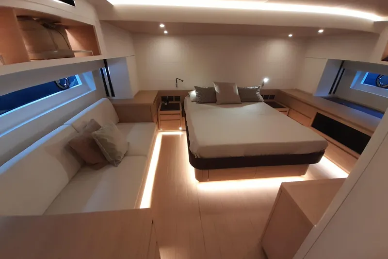  Yacht Photos Pics Luxurious interior of 2023 Pardo Yachts E60, featuring modern bedroom with ambient lighting.