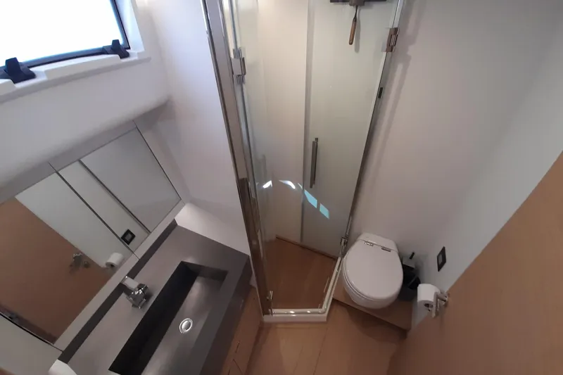  Yacht Photos Pics Bathroom interior of 2023 Pardo Yachts E60, featuring modern sink, toilet, and shower.