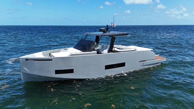  Yacht Photos Pics 2021 De Antonio Yachts D42 cruising on open sea under clear blue sky.