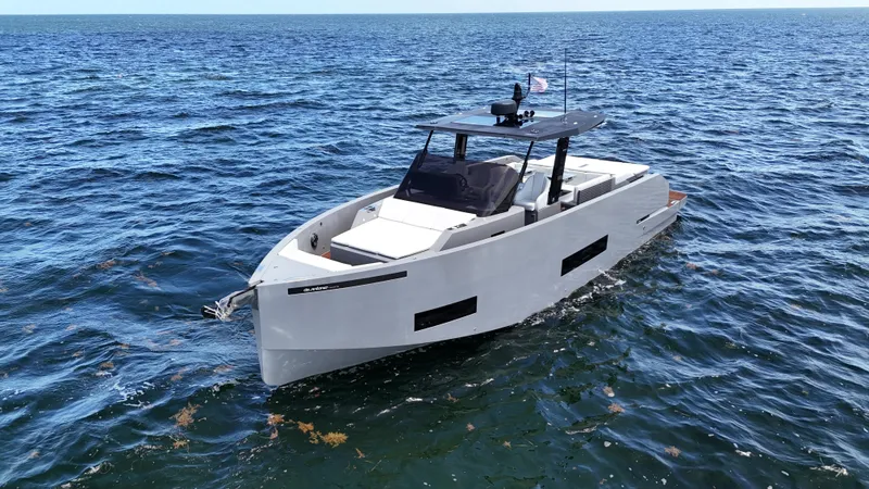  Yacht Photos Pics 2021 De Antonio Yachts D42 cruising on open water, showcasing sleek design and modern features.