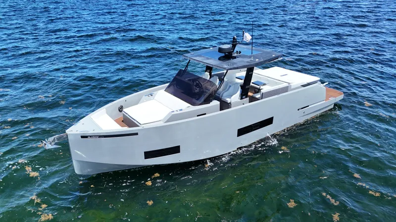 Yacht Photos Pics 2021 De Antonio Yachts D42 cruising on open water, showcasing sleek design and modern features.