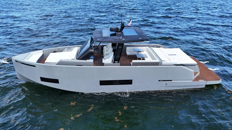  Yacht Photos Pics 2021 De Antonio Yachts D42 cruising on open water, showcasing sleek design and modern features.