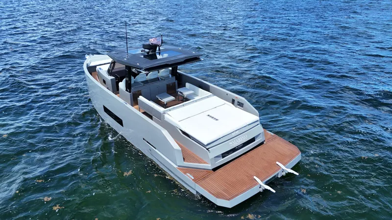  Yacht Photos Pics 2021 De Antonio Yachts D42 on open water, showcasing sleek design and spacious deck.