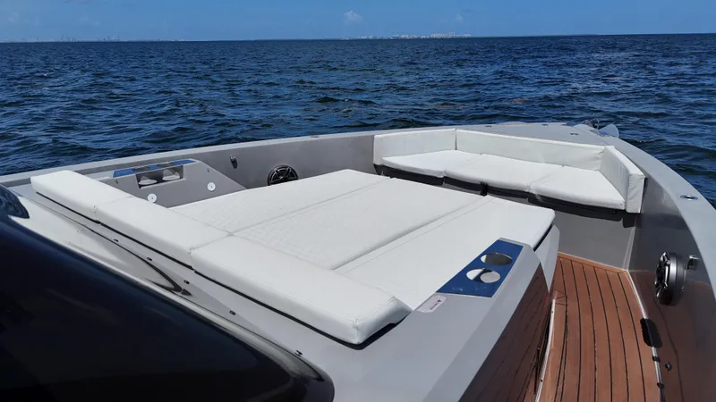  Yacht Photos Pics Luxurious 2021 De Antonio Yachts D42 with spacious deck and seating, cruising on open water.