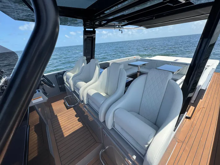  Yacht Photos Pics Luxurious 2021 De Antonio Yachts D42 interior with white seating and ocean view.