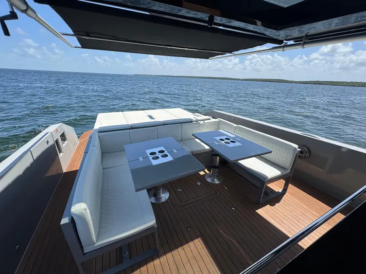  Yacht Photos Pics Luxurious 2021 De Antonio Yachts D42 with elegant seating and ocean view.