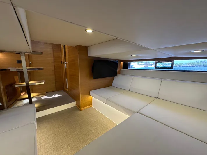  Yacht Photos Pics Luxurious interior of 2021 De Antonio Yachts D42 with modern seating and wooden accents.