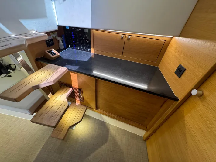  Yacht Photos Pics Interior of 2021 De Antonio Yachts D42, featuring sleek wooden cabinetry and modern design.