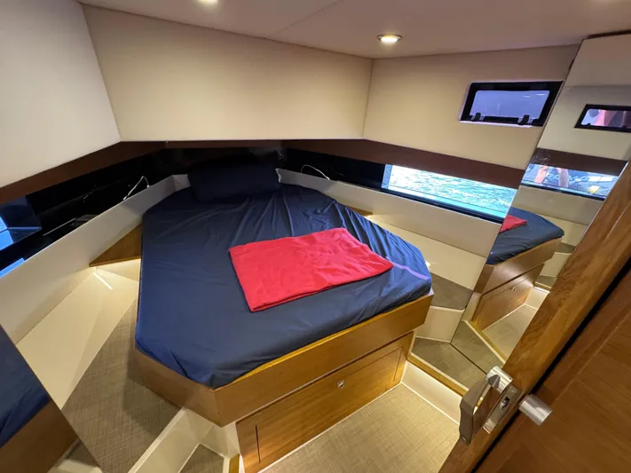  Yacht Photos Pics Luxurious cabin interior of 2021 De Antonio Yachts D42 with cozy bed and modern design.