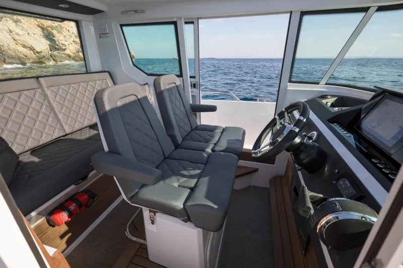  Yacht Photos Pics Interior of 2022 Axopar 28 CABIN with ocean view.