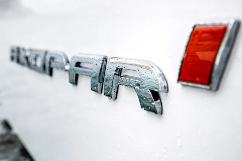  Yacht Photos Pics Close-up of Axopar 28 CABIN logo, 2022 model.