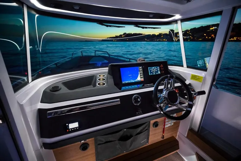  Yacht Photos Pics Interior view of 2022 Axopar 28 CABIN with modern helm console.